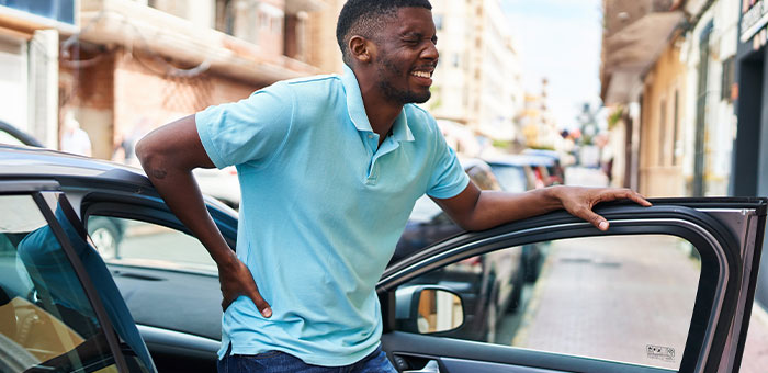 patient with hip pain needing auto accident chiropractor in Sherman
